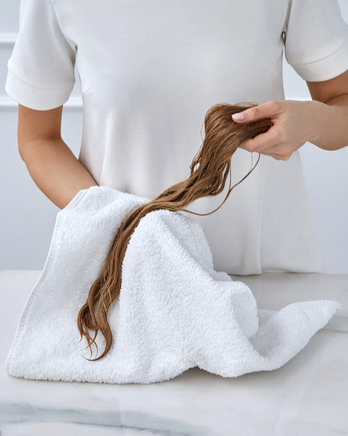drying hair with a towel