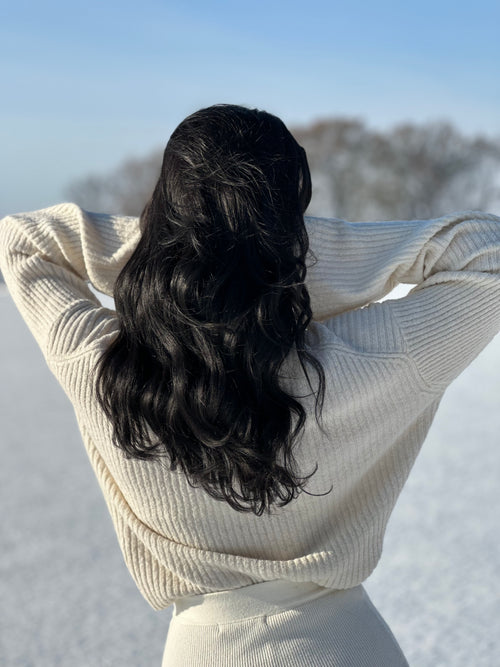 model with black hair extensions in winter