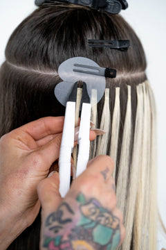 keratin hair extensions application with heat iron