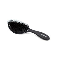 oval black brush for hair extensions with boar bristles