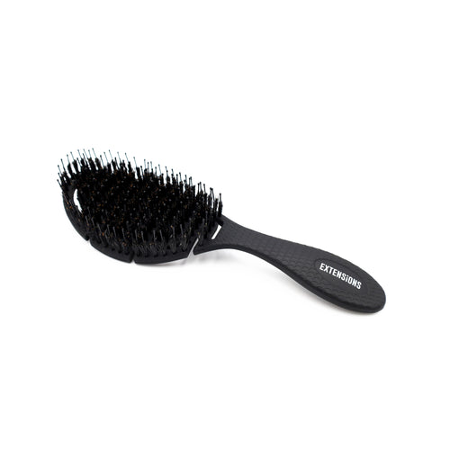 oval black brush for hair extensions with boar bristles