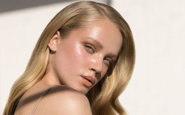 invisible tape in hair extensions blond model