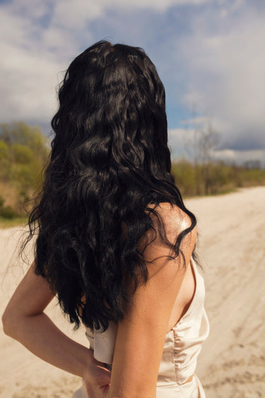 black hair extensions model with beach waves