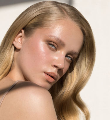 invisible tape in hair extensions blond model
