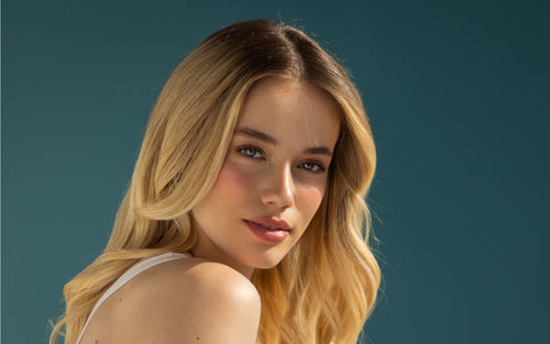 model with 4cm tape in extensions rooted blond